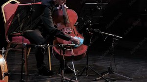 symphonic orchestra cello play in a large hall