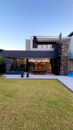 🏆Here’s the countdown of my TOP-5 REELS of 2025 — this is # 1 posted on 22 July. Discover this home where every detail is meticulously crafted for connection and celebration. From the impressive curb appeal—a dynamic mix of smooth plaster, white-washed brick, glass, and steel—to the serene water feature and internal garden, this residence is a work of art. Step through the double-volume entrance and be greeted by a feature staircase with elegant LED strip lighting. The home’s design flows with