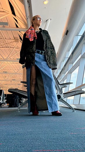 Heading to New York with my little minions and yes, I wore a slit skirt with built-in panties on the plane. Why? Because bending, lifting, squatting, twisting — motherhood is a sport and this outfit is the uniform. Black tee (hide the stains). Thrifted bomber (oversized and fabulous). Red cowboy boots (so I don’t lose them when I inevitably kick them off). Hairpiece to disguise my “plane hair” because flights make me feel… dusty. Follow along for more travel-style madness. 💛✈️ #FeelIntoFashion 