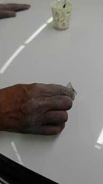 VW Tiguan engine hood stone chip repair with steel touch-up.