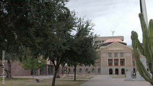 Arizona state capitol building in Phoenix, Arizona with closeup showing trees and panning left to right.