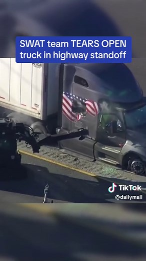 SWAT Police in Houston, Texas used an armoured battering ram to pry open the cabin of an 18-wheeler to arrest the driver following an hours-long standoff on Wednesday, trapping drivers in gridlock for hours on the freeway. #texas #fyp #swat #standoff #freeway #arrest #crime #houston #police #gridlock #armouredvehicle