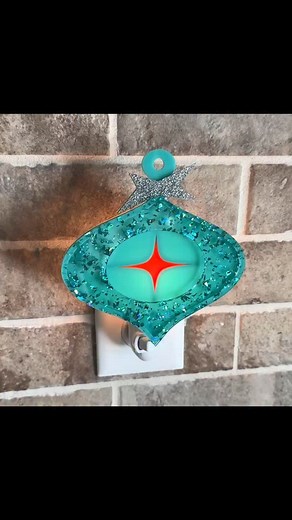 Our new “Mavis” Night Light features a shimmering ornament design and is ready to glow all season! ✨ Now available at atomicavocado.com! #atomicavocadodesigns #midcenturymodern #retroholiday #retrochristmas #christmasornaments #nightlights | Atomic Avocado Designs