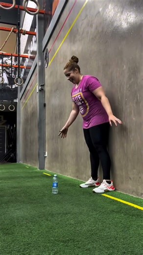 Lift the bottle challenge while keeping knees locked and hips touching the wall. #flexibility #gym