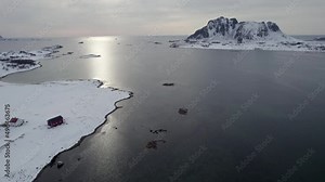 Norwegian traditional Farm seaside along the Norwegian coast, Aerial view left to right orbit shot.