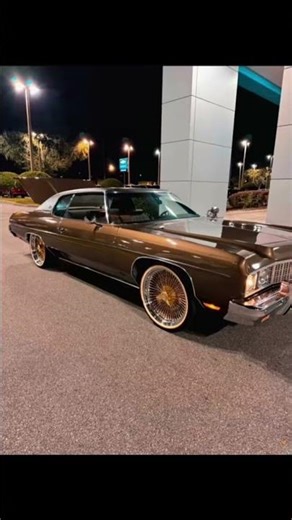 1973 Chevy Impala on 22” Gold Spokes