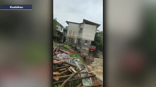 House crashes into river after heavy flooding in China