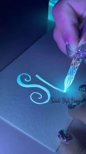 Watch the Magic of Glowing Ink in Calligraphy