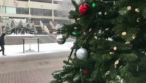 Campus turns into a winter wonderland as snow falls and students make their way across the Academic Walk in front of the Duquesne Union on Tuesday afternoon. | Duquesne University