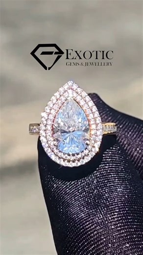 Exotic Gems & Jewellery on Instagram: "PEAR CUT MOISSANITE BEAUTY! 😍 Exquisitely crafted in 18k rose gold, this double halo Moissanite ring radiates unmatched brilliance. 💫 Featuring a dazzling pear-shaped center stone and channel-set round brilliant Moissanites along the shank, it’s the perfect blend of luxury and timeless design. Elevate your love story with a piece that captures every glance. ✨💍 . Enjoy 40% off now on all Moissanite jewellery! . . Dm or whatsapp for fu