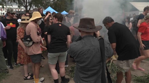 Around a thousand march in Invasion Day rally in Canberra, protesting at Parliament House