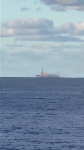 Blue Origin New Glenn second flight hovering and landing on drone ship as seen from far away