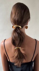 The accessories you never knew you needed? Lelet NY's pony cuffs. Styling them is simple, guaranteed to add a chic flair to any end-of-summer outfit. Shop them now on Moda. https://modaoperandi.visitlink.me/dbY8CD | Moda Operandi