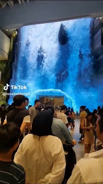 Dynamic Waterfall Animation Captivates Diverse Crowd