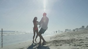Romantic couple on vacation having fun together on beautiful beach