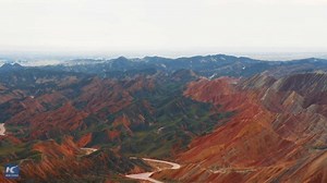 92K views · 206 shares | In NE China there's some remarkable rippling hills called Colorful Zhangye Danxia. There you'll see the colors of the rainbow. Where did this color scheme come from? Click to find out! #AmazingChina | Xinhua Culture&Travel | Facebook