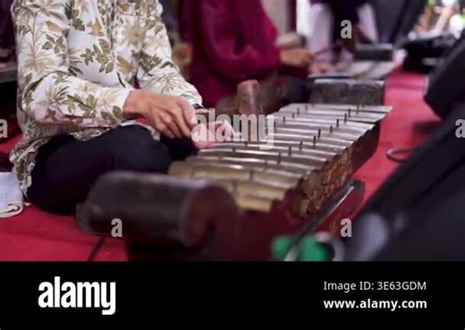 Traditional Gamelan Musician Playing Metallophone Instrument Closeup Stock Video Footage - Alamy