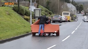 Hilarious attempt to get sofa down the road doesn't end well