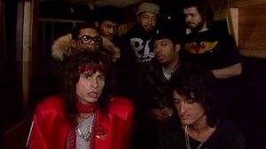 When Aerosmith and Run DMC teamed up on "Walk This Way," they smashed through barriers both literally and figuratively. Their music video featured a fun "battle of the bands" showdown, mixing mainstream rock and hip-hop in a groundbreaking way. This new episode of Music Mayhem is all about “Crazy Collaborations” in rock history. Premieres TONIGHT at Midnight ET on AXS TV! #musicmayhem | AXS TV