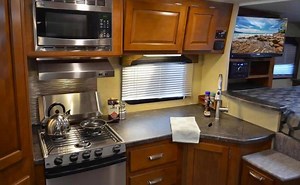 2.5K views · 34 reactions | The 995 was designed to provide maximum living space! In the kitchen area you will find large counter space for convenient food preparation on the road. Learn more about it here: https://goo.gl/yJEkiL | Lance Camper | Facebook