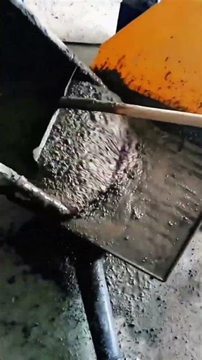 Wet concrete spreads tool guides surface smooth strength forms