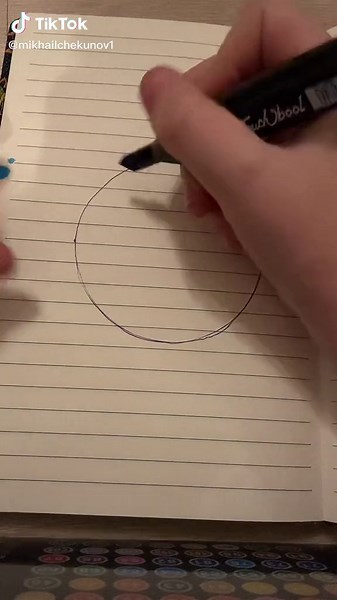 Drawing Process: Creating a Blue Circle on Notebook