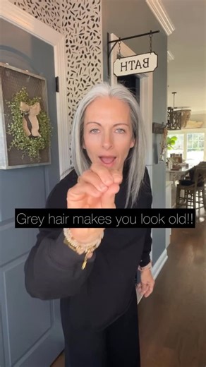Debbie: Grey Hair Transition on Instagram: "How to deal with dumb comments in 2026. 🤭 Contrary to popular belief: Grey hair is actually JUST a hair color. Just like blond, brunette, or red head. It’s natural and not only does it NOT make you look old, it actually adds vibrancy to your skin and makes your eyes pop in my opinion. 🥰 If you think it makes me look older? I simply do not care! You can take that opinion and shove it where the sun don’t shine ☀️ 🤭😎 #unpopularopinion #sundontshine #2