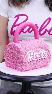BARBIE HANDBAG CAKE! 💗👜 You guys requested I turn my cakeside forward cake into a bag, so here ya go! What's your verdict?? I used my 5 inch Frost Form to create this hybrid ganache cake before giving it a transformation 😊 - use code FROSTLOVE10 for 10% off at frostform.com Barbie stamp and cut - Sweet Stamp - Amy Cakes - code LOVE10 for 10% off at www.sweetstamp.online Pink glitter: Fancy Sprinkles tourmaline pink prism powder- code 15LOVEISBAKEABLE for 15% off at fancysprinkles.com #barbiec
