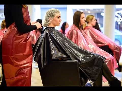 Modern Salon scene. Young woman in a shampoo cape.
