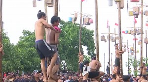 Indonesia holds 'greasy' tree-climbing competition