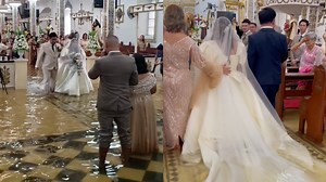 Watch: Filipino bride walks down flooded aisle after Typhoon Doksuri hits Philippines