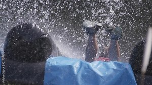 Sports and recreation obstacle course race wet slippery jump mud slide