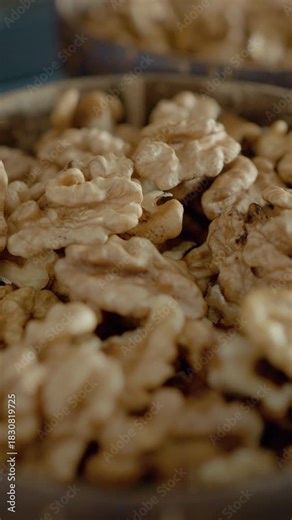 Vertical Screen: Enjoy a close look at walnut kernels that are rich in healthy fats. Learn about their nutritional value and how they can enhance meals and snacks.
