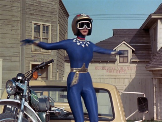 Wonder Woman (Lynda Carter & Kitty O'Neil) looking wonderful in their blue spandex motorcycle catsuit riding a motorcycle, chasing a bad guy. To be fair, Kitty O'Neil (Lynda's Stunt Double) is in the majority of this clip for the riding and stunts. | Lynda Carter Everything
