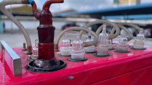 Glass tubes and bottles mounted on Impinger and HVAS (High Volume Air Sampler) tools. Tool for measuring air cleanliness. Closeup shot. Depth of field (DOF), Selective focus.