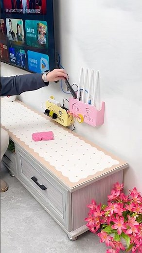 Install a storage box like this next to the TV, and you can wall-mount and store your router