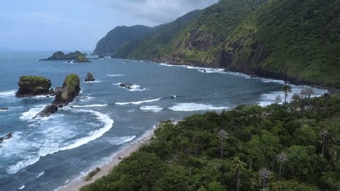 clip-4005702523-cinematic-drone-shot-papuma-beach-ocean-waves