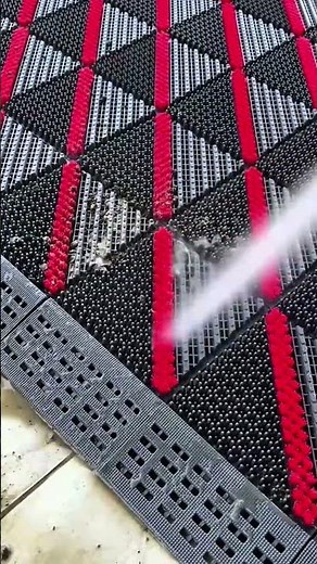 Installing interlocking floor tiles by aligning and securing them with a rubber mallet #contruction