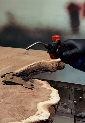 Finishing touches this week ya’ll! 😍 This beautiful piece of Siberian Elm, which will be a standing desk and counter top, is about to head to it’s final home. #woodworker #woodworkingcommunity #liveedgefurniture #standingdesk #liveedgeslab #epoxyresin #epoxy #asmr