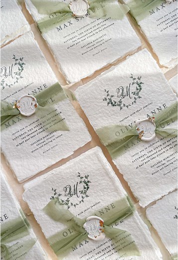 Handmade paper wedding invitations assembled with silk ribbons and white wax seals with golden leaf 🥰✨ . www.kattone.com . . #weddingstationery #weddinginvite #weddinginvites #weddinginvitations #handmadepaper #decklededgepaper #weddingplanner #silkribbons #cottonpaperinvitations #bridalshower #weddinginvitation #saveourdate #handmadepaper #weddingplanner #archinvitations #foilayage #vellum #savethedate #weddingphotographer #weddingflowers #invites #stationery #waxseals #menus #daystationery #l