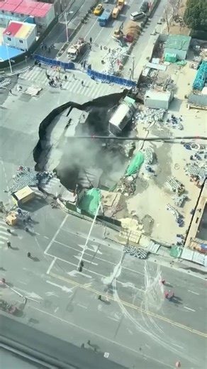 A large sinkhole appeared in Shanghai's Minhang District, engulfing a large section of road and causing damage to nearby structures. The incident occurred a day after workers discovered a water leak during excavation for the Jiamin Metro Line. #shanghai #sinkhole #minhang #metro #construction | Reuters