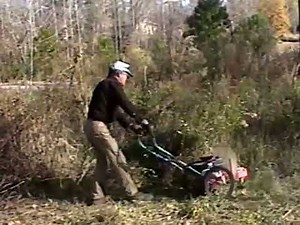 Pieter J.C. Vedder Using the DR Trimmer Mower with Beaver Blade and String