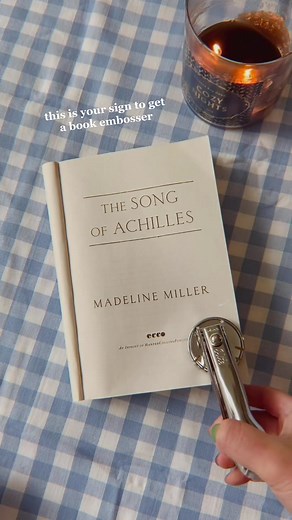 one of the best gifts I’ve ever received from @carcaryayayee is this book embosser 🤍 #bookembosser #bookstamp #songofachilles #madelinemiller