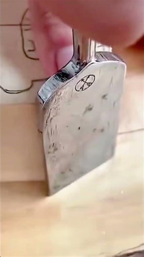 wood carving process using sharp metal gouge tool to hollow out circular shape in solid timber block