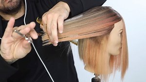 Cutting a long bob on dry hair can help keep the cut soft. Pull the hair back to create length in the front while using techniques like tease cutting and point cutting to keep your lines soft | Matt Beck