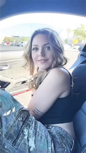 Women puts on a funny viking helmet