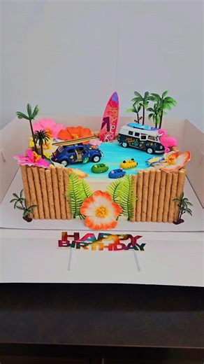 Dessert Treats by Karen on Instagram: "Hawaiian Luau themed birthday cake. 2 layers, 1/2 sheet cake. Half chocolate, half vanilla. Layered with vanilla buttercream."
