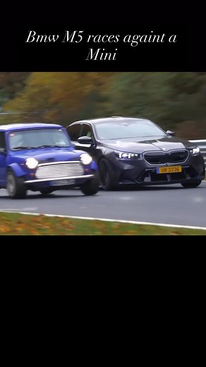 78K views · 1.3K reactions | BMW M5 tries to keep up with a classic Mini at the ’Ring That tiny blue classic Mini estate is flying, carrying momentum and perfect lines while a BMW M5 hammers behind trying to keep up. Lightweight agility vs. brute horsepower in the Green Hell.  #Nürburgring #GreenHell #BMWM5 #ClassicMini #MiniEstate #TrackBattle #Chasing #MomentumOverPower #LightweightVsPower #RingLife #CarSpotting #DrivingSkills #car #bmw | Boosted Nation | Facebook
