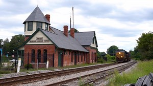 14K views · 981 reactions | On an overcast summer afternoon, we witness CSX train F763 rolling down the company's Peninsula Subdivision with a double-stack intermodal train. The Suffolk Railroad Museum is the star of the scene, however. The museum is housed inside the former Seaboard Station, which was built in 1885. #trainiac | Trainiac Productions | Facebook