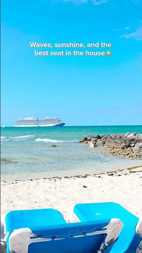 Take in the soft roll of the waves and the glow of Enchanted Princess anchored off Princess Cays.